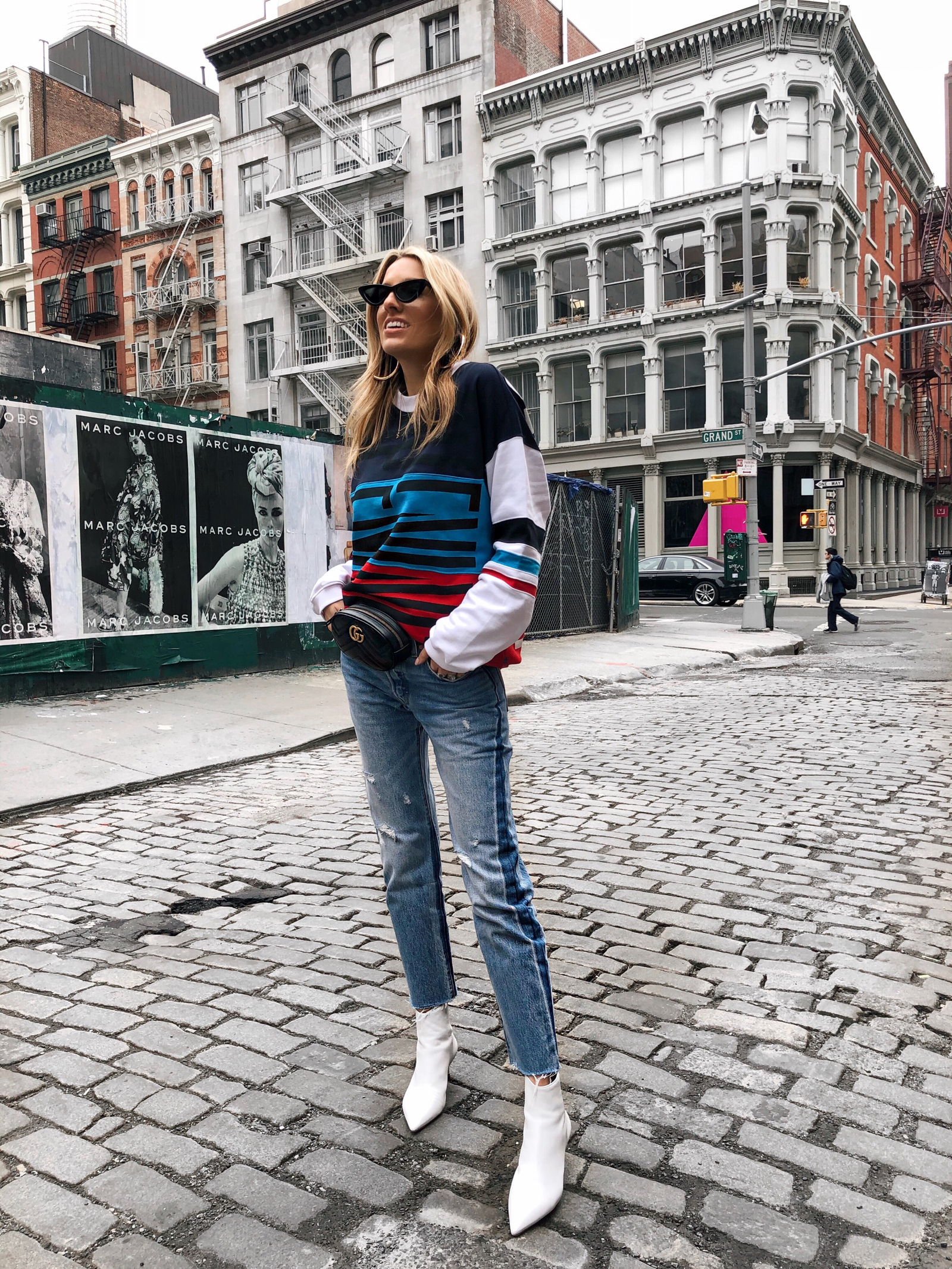 NYFW Fall 2018 Street Style, Gucci Belt bag, White boots, Levis, Graphic Sweatshirt, New York Fashion Week