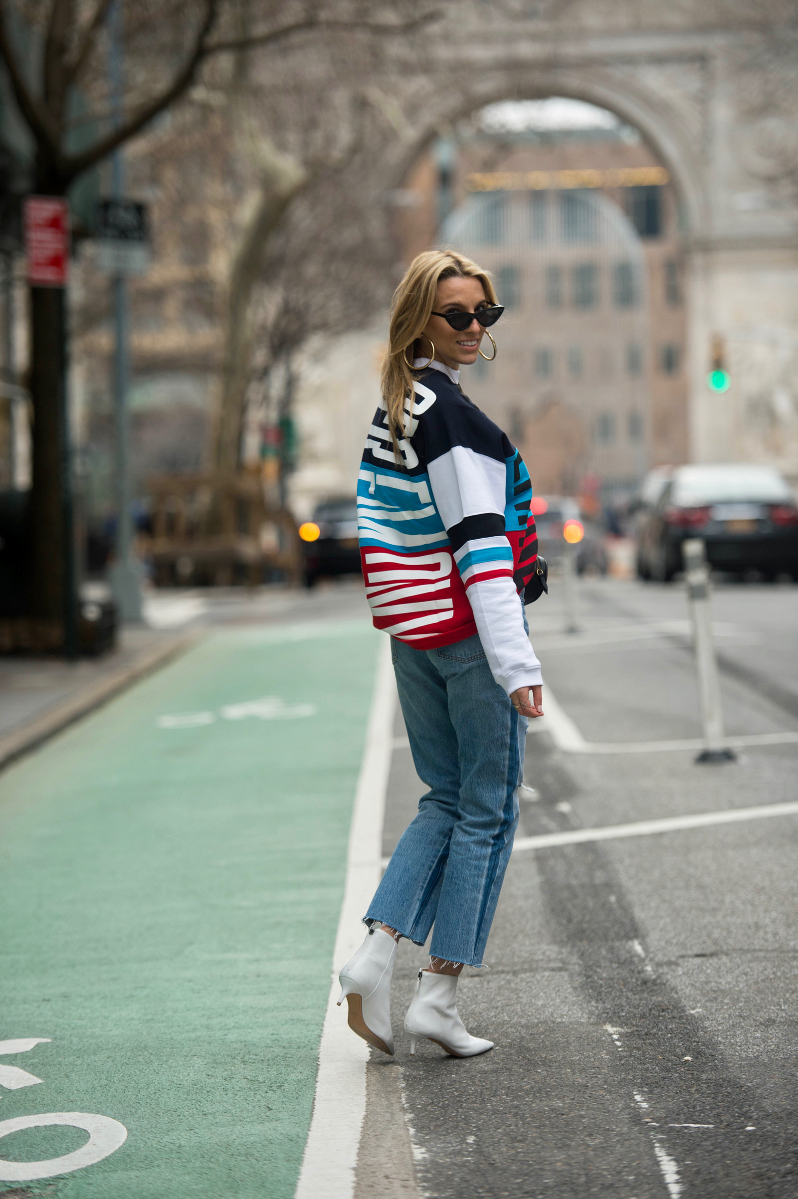 NYFW Fall 2018 Street Style, Gucci Belt bag, White boots, Levis, Graphic Sweatshirt, New York Fashion Week, Opening Ceremony, White, Le Specs